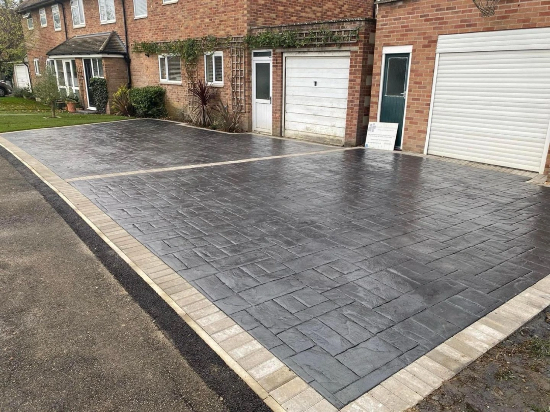 Finished imprinted concrete driveway by Axtell Landscaping